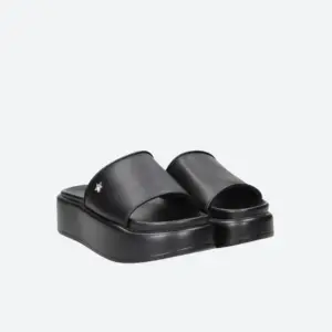 Shop Art slippers in black